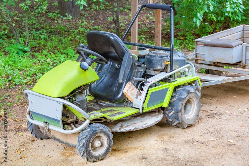 Small mobile tractor for landscaping gardens and parks