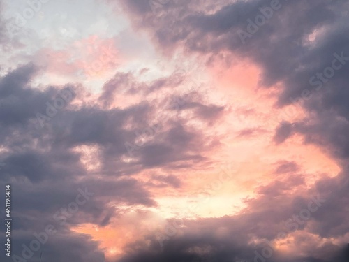 Beautiful sunset over sea with reflection in water, majestic clouds in the sky