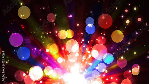 Shining multicolored golden bokeh on dark background, magic light, holiday. Bright glitter particles. Wonderful colorful sparkling background