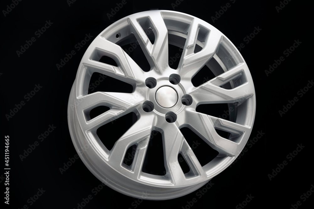 Obraz premium car alloy wheel, new, beautiful, unusual modern silver on a black background