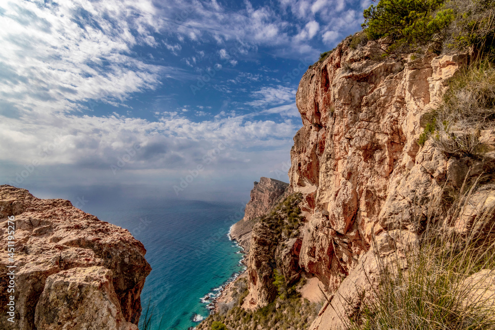 natural park serra gelada in benidorm. view of cliffs in a clouds sky, landscape located in the Valencian community, Alicante, Spain