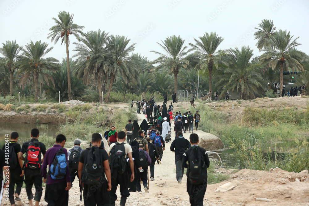 The walk from Najaf to Karbala to the shrine of Imam Hussein Ibn Ali in Iraq The walk from Najaf to Karbala to the shrine of Imam Hussein Ibn Ali in Iraq