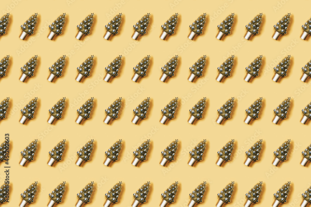 Christmas background. Pattern christmas tree decorated with balls on a yellow background Christmas background. Pattern christmas tree decorated with balls on a yellow background