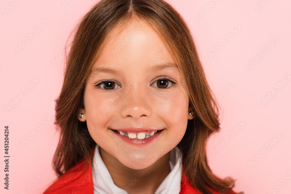 portrait of happy girl looking at camera isolated on pink portrait of happy girl looking at camera isolated on pink
