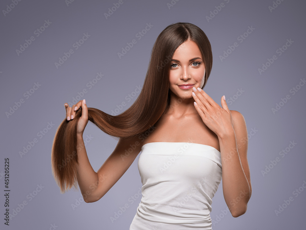 Fototapeta premium Woman with long smooth hair breunette natural make up healthy skin manicure nails