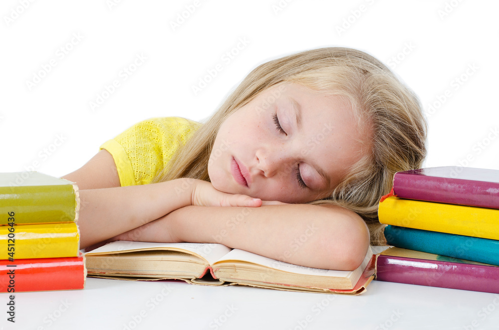 Sleeping while learning - tired little girl sleeping on desk. Isolated on white background
Sleeping while learning - tired little girl sleeping on desk. Isolated on white background