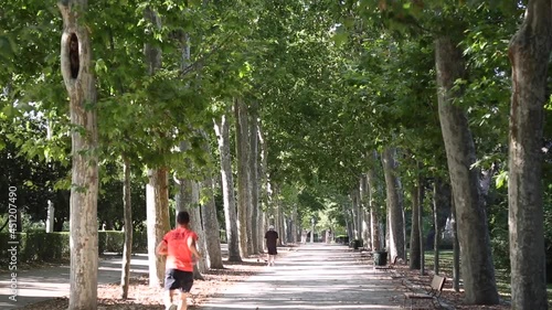 Runners in Retiro Park, Madrid, Spain
