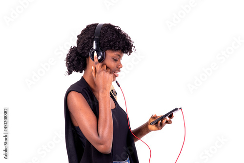 portrait of a young student listening to music, smiling