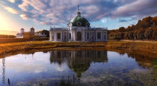 Picturesque Grotto Pavilion and its water reflection in swamped pond in Kuskovo manor park in Moscow.