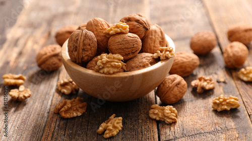 bowl of walnut on wood background