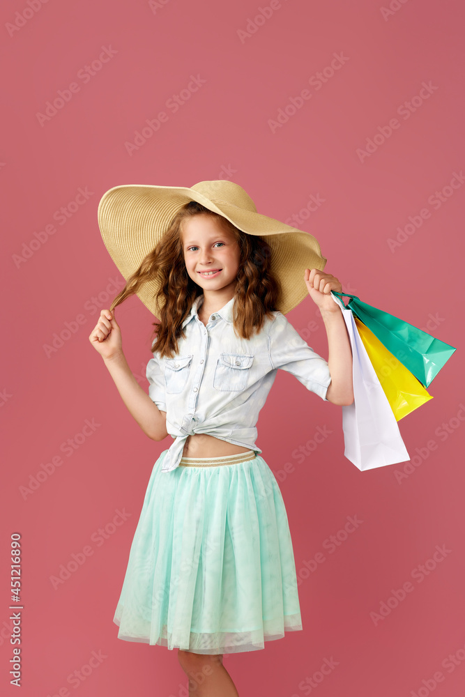 cute little caucasian child girl holds shopping bags cute little caucasian child girl holds shopping bags