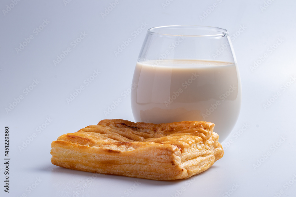 Pineapple pie with fresh milk in a clear glass on a white background. Pineapple pie with fresh milk in a clear glass on a white background.