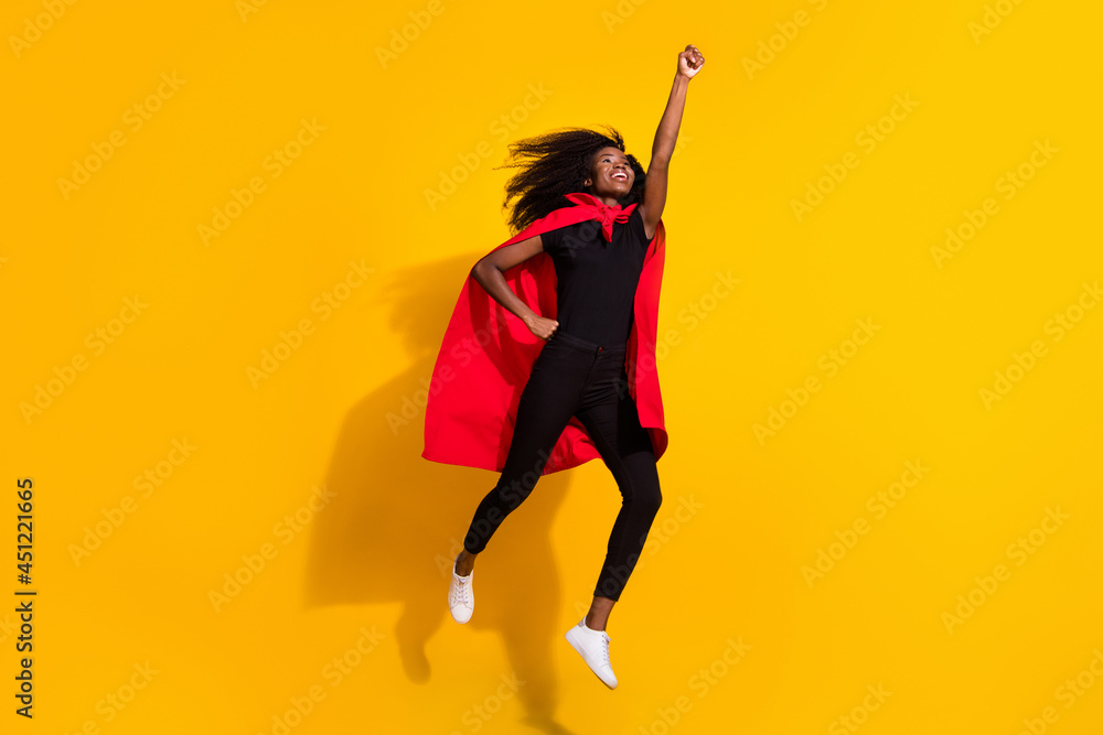 Full length photo of hooray super young lady jump wear black cloth cape isolated on yellow color background