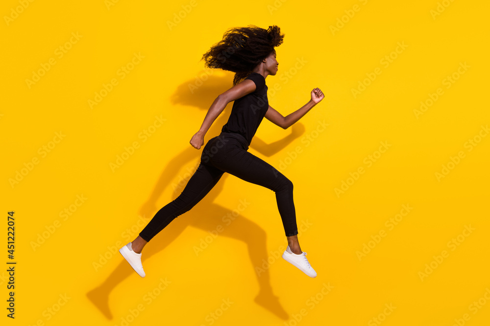 Full length body size side profile photo curly girl jumping up running on sale isolated vivid yellow color background