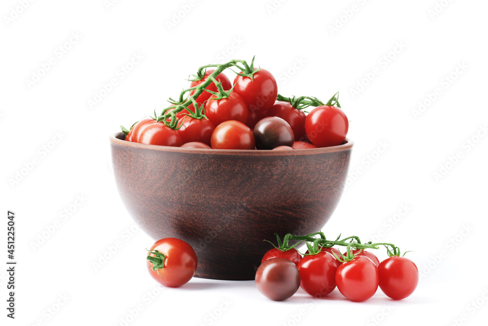Ripe juicy cherry tomatoes in a bowl isolated on white background Ripe juicy cherry tomatoes in a bowl isolated on white background