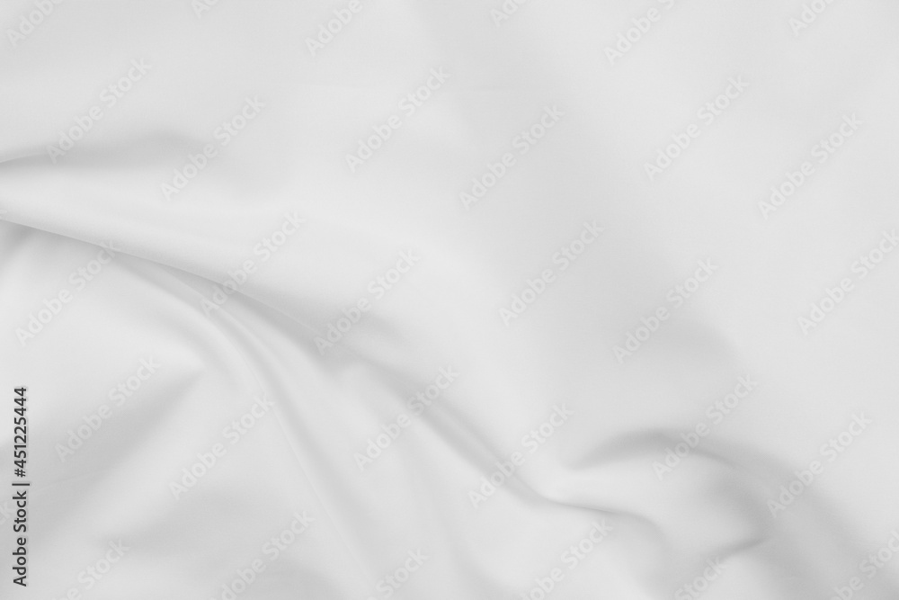 Naklejka premium Abstract white fabric texture background. Cloth soft wave. Creases of satin, silk, and cotton.