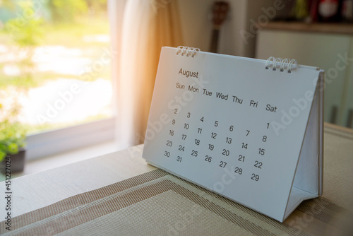 2021 Calendar desk place on table. Desktop Calender for Planner to plan agenda, timetable, appointment, organization, management each date, month, and year on wooden office table.Calendar Concept.