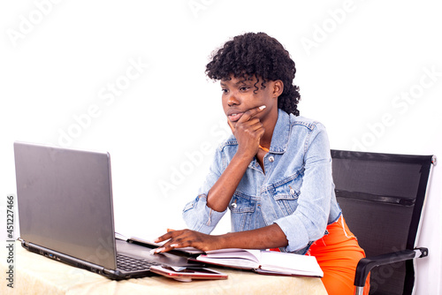 young concentrated student girl studying with laptop.