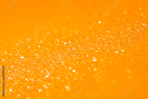 Water drop on glass abstract background. orange background , Orange bokeh.