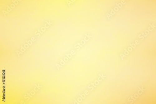 Abstract blurred background in soft pastel tone for aesthetic of autumn and fall design. Color and light gradient in warm earth tone background.
