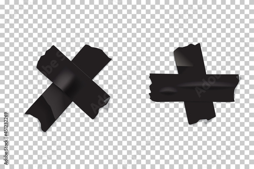 Crosses made of pieces of black adhesive tape isolated on transparent background. Vector realistic duct or masking tape parts. photo