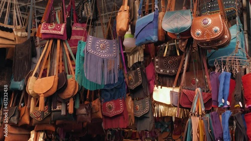 Marrakech - market stalls in Medina old city. Bags and leatherin Marocco marketplace, craftsman product arabian