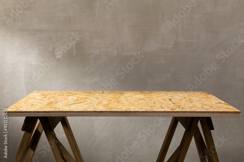 Wooden osb table top background texture. Wood tabletop front view photo