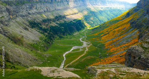 Aérea Panorámica de la  Pradera de Ordesa en  Parque Natural Ordesa en  Pirineos, con un espectacular colorido de verdes y naranjas photo