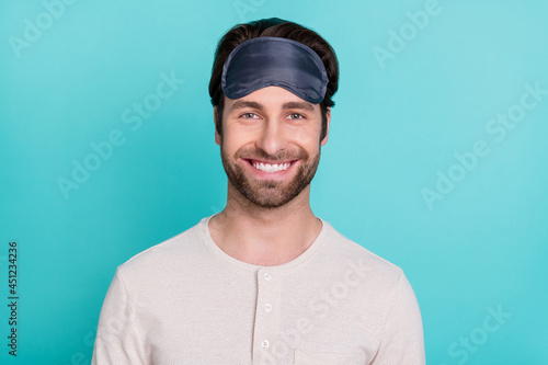 Photo of young cheerful man happy positive smile awake morning isolated over turquoise color background