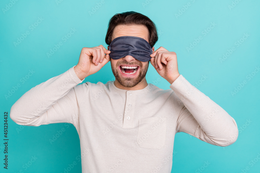 Naklejka premium Photo of young man excited close eyes sleeping mask bedtime isolated over turquoise color background