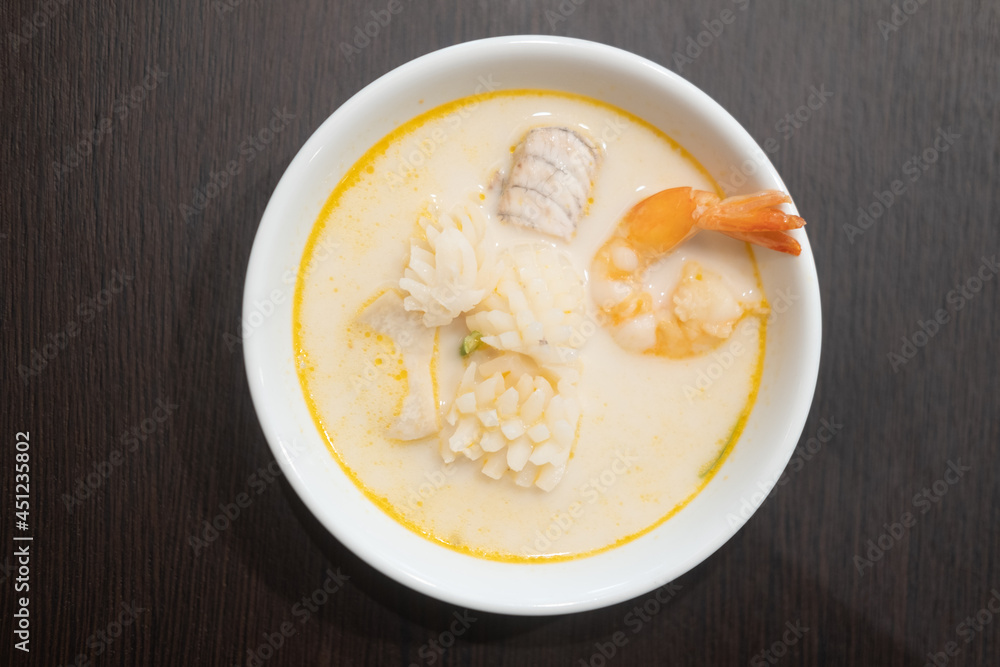 Curry in coconut milk with shrimp, squid and fish Curry in coconut milk with shrimp, squid and fish
