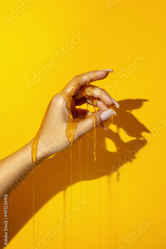 Crop model with honey flows on hand photo