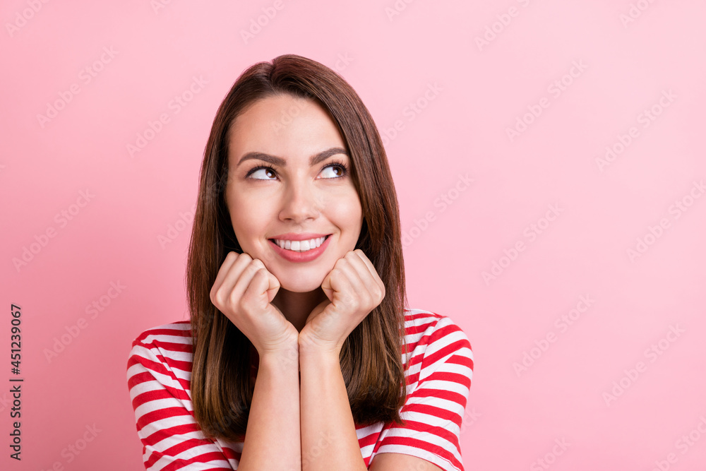 Photo of sweet young brunette lady hands face look empty space wear red t-shirt isolated on pink color background