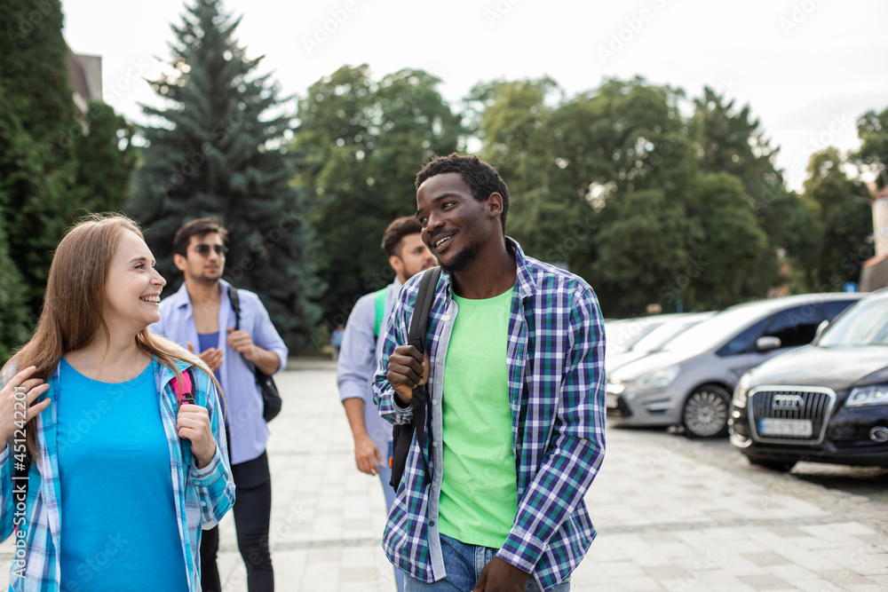 Naklejka premium Group of high school students talking and laughing