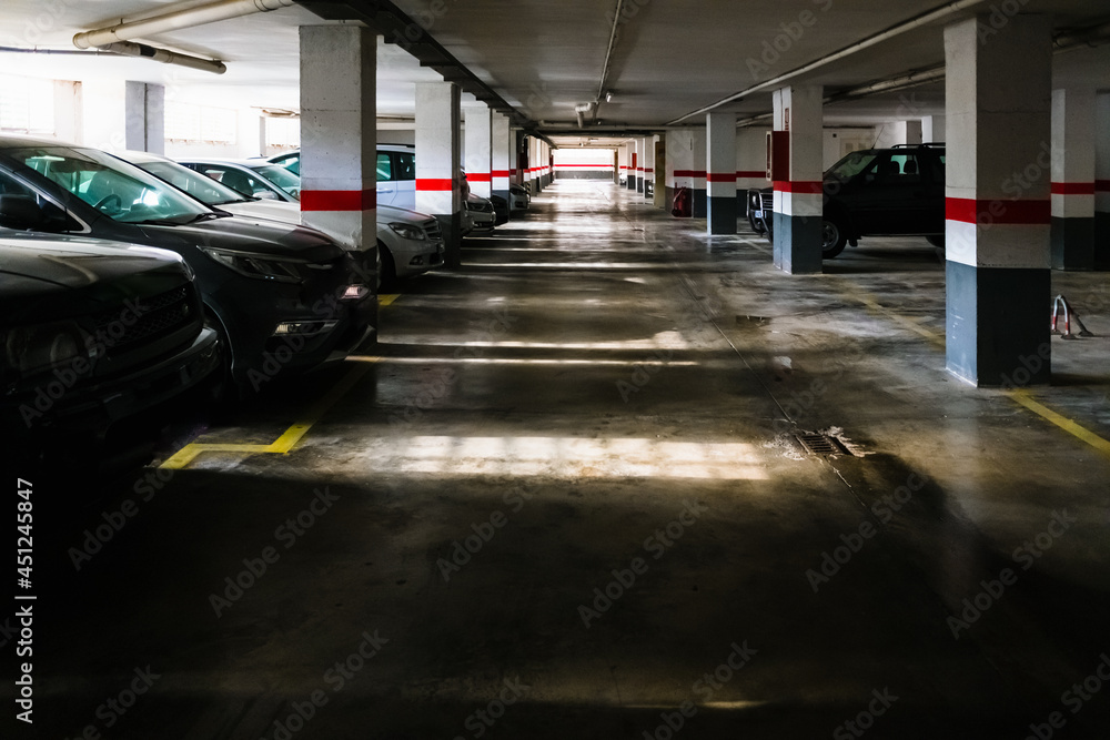 Old car park in a building on the ground floor, with natural sunlight. Old car park in a building on the ground floor, with natural sunlight.