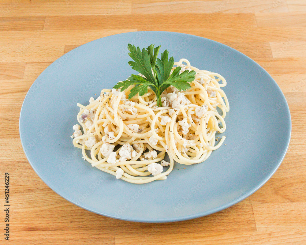 Pasta with minced chicken, decorated with a sprig of parsley. Pasta with minced chicken, decorated with a sprig of parsley.