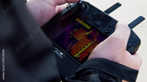 preparing a big drone RTK for flying over a roof to measure its size, changing Batteries, unfold the wings, camera 