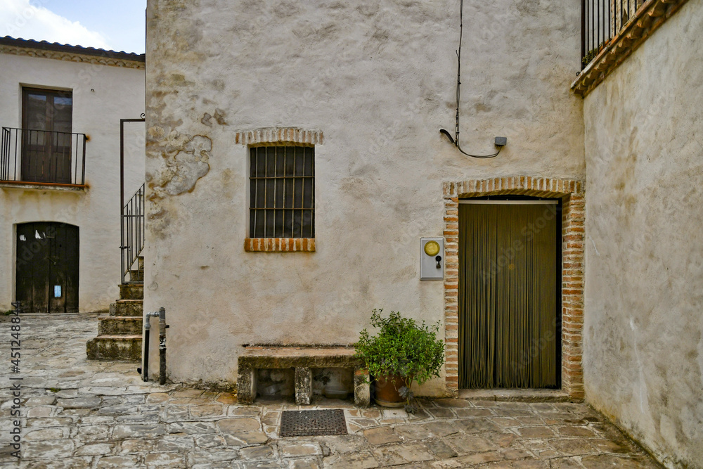 The facade of an old house in the historic center of Aliano, a medieval town in the Basilicata region, Italy.