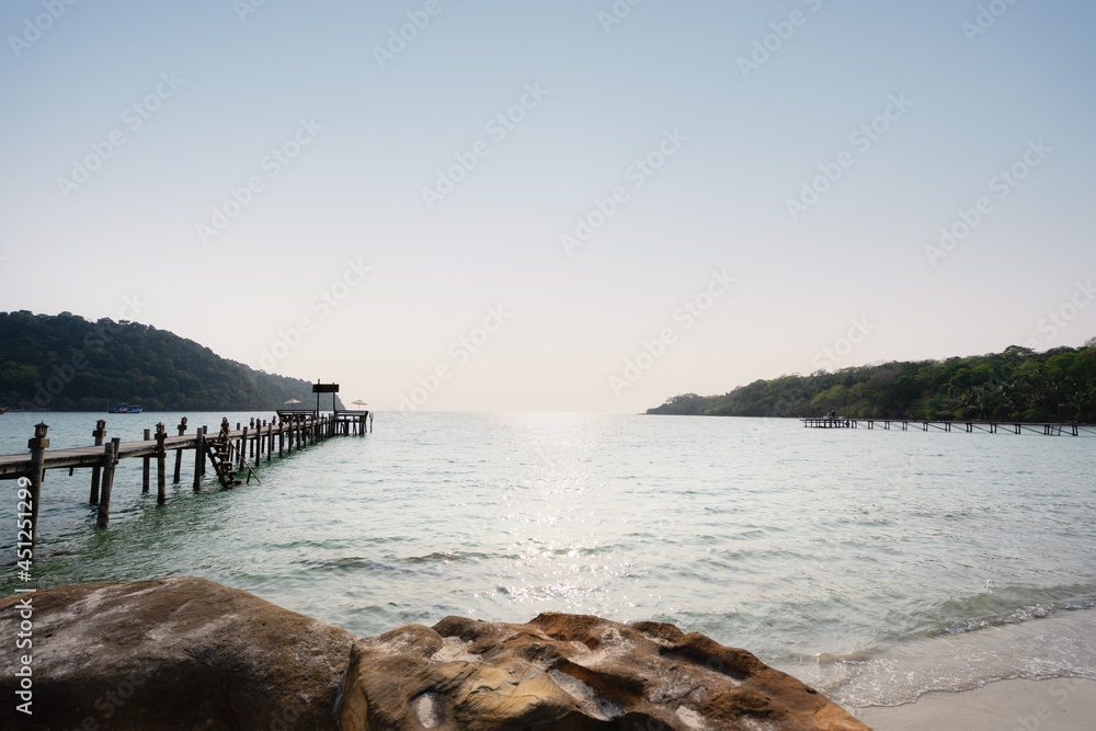 Wooded bridge with beautiful tropical beach in island Koh Kood , Thailand, selective focus on foreground.