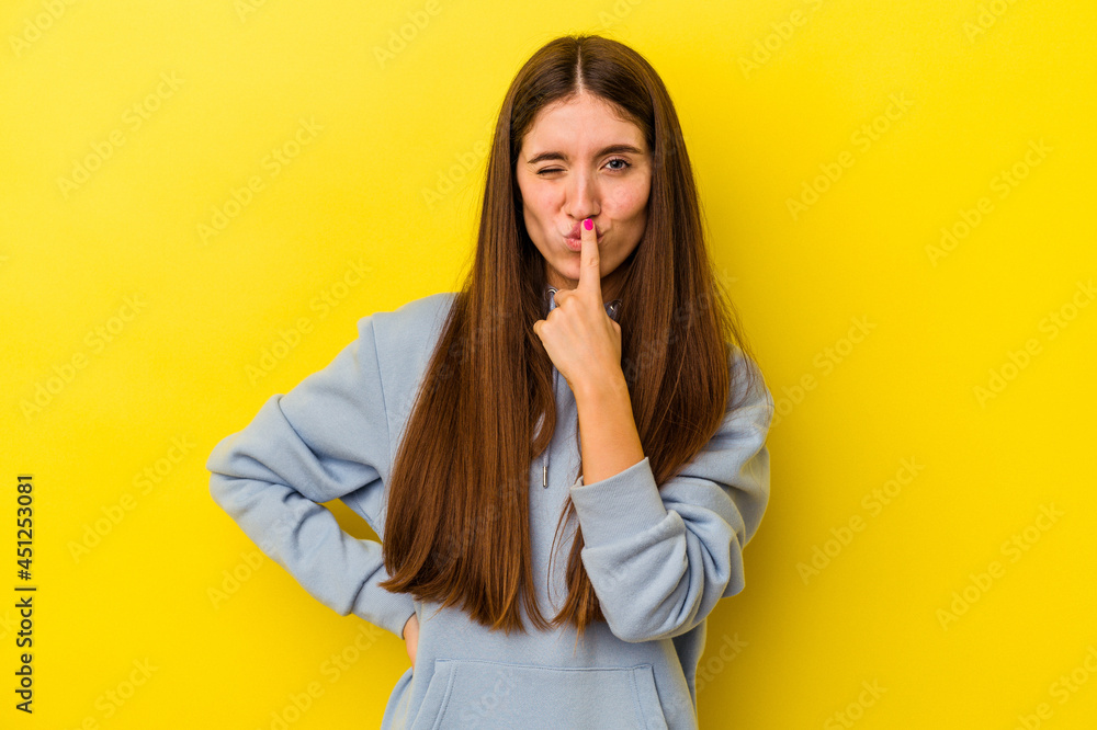 Young caucasian woman isolated on yellow background thinking and looking up, being reflective, contemplating, having a fantasy. Young caucasian woman isolated on yellow background thinking and looking up, being reflective, contemplating, having a fantasy.