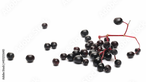 Elderberries, elder berries pile isolated on white background