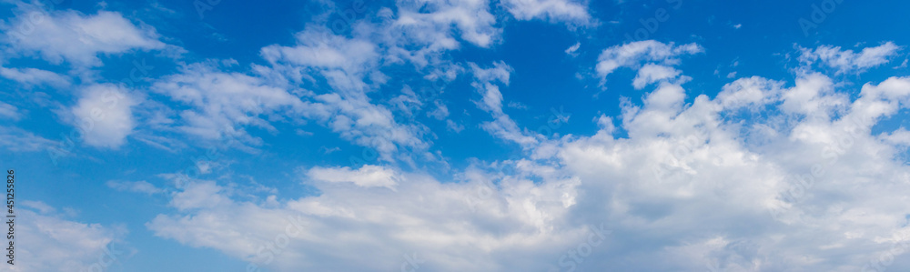 Luxurious white clouds in the blue sky on a sunny day Luxurious white clouds in the blue sky on a sunny day
