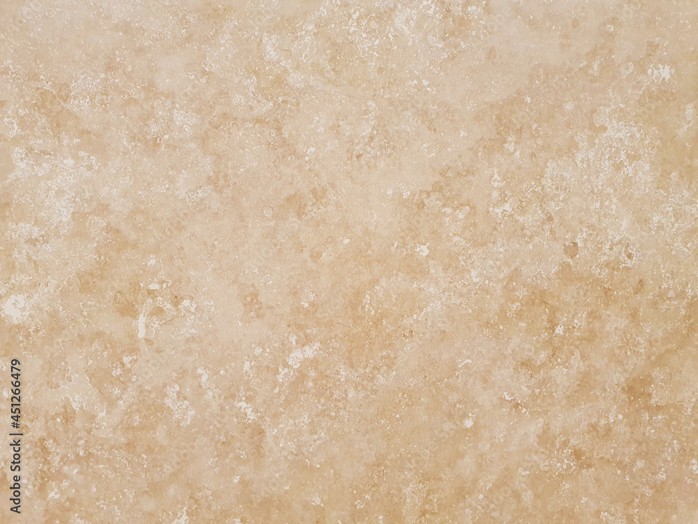 Beige color natural stone wall texture for background or backdrop