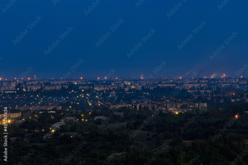 A bird's-eye view of the city at night. Bright lights of a big city in Eastern Europe
