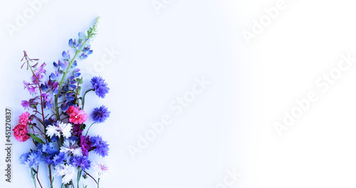 Fototapeta Naklejka Na Ścianę i Meble -  Bright elegant summer bouquet with blue and pink flowers on a white background. Background for greeting cards, greetings, invitations.