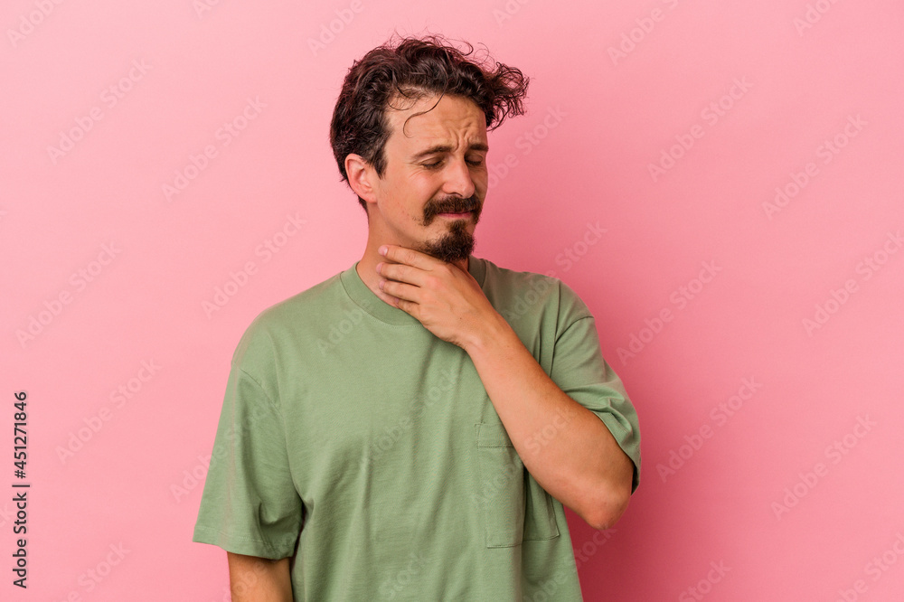Young caucasian man isolated on pink background suffers pain in throat due a virus or infection. Young caucasian man isolated on pink background suffers pain in throat due a virus or infection.