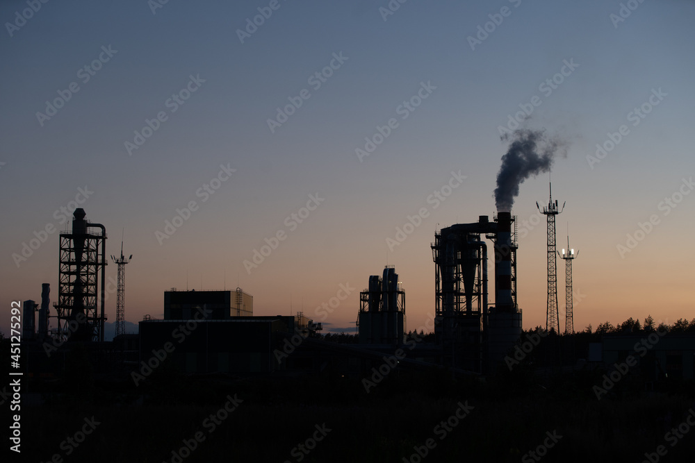 Factory pipe polluting air against sunset, environmental problems, smoke from chimneys.
