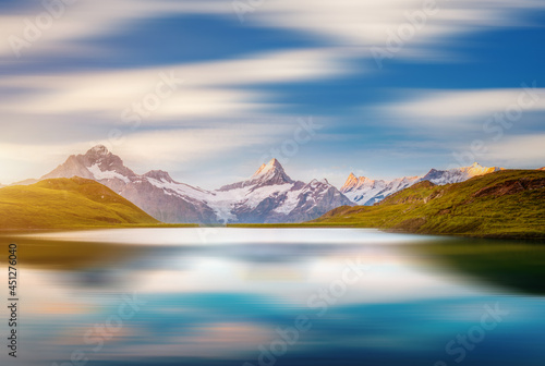 Great summer view of the Bachalpsee lake and rocky massif. Grindelwald valley, Switzerland.