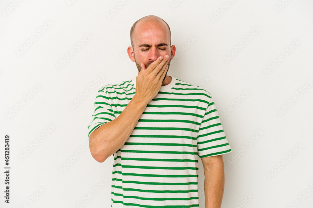 Young bald man isolated on white background yawning showing a tired gesture covering mouth with hand. Young bald man isolated on white background yawning showing a tired gesture covering mouth with hand.