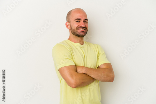 Young bald man isolated on white background happy, smiling and cheerful.